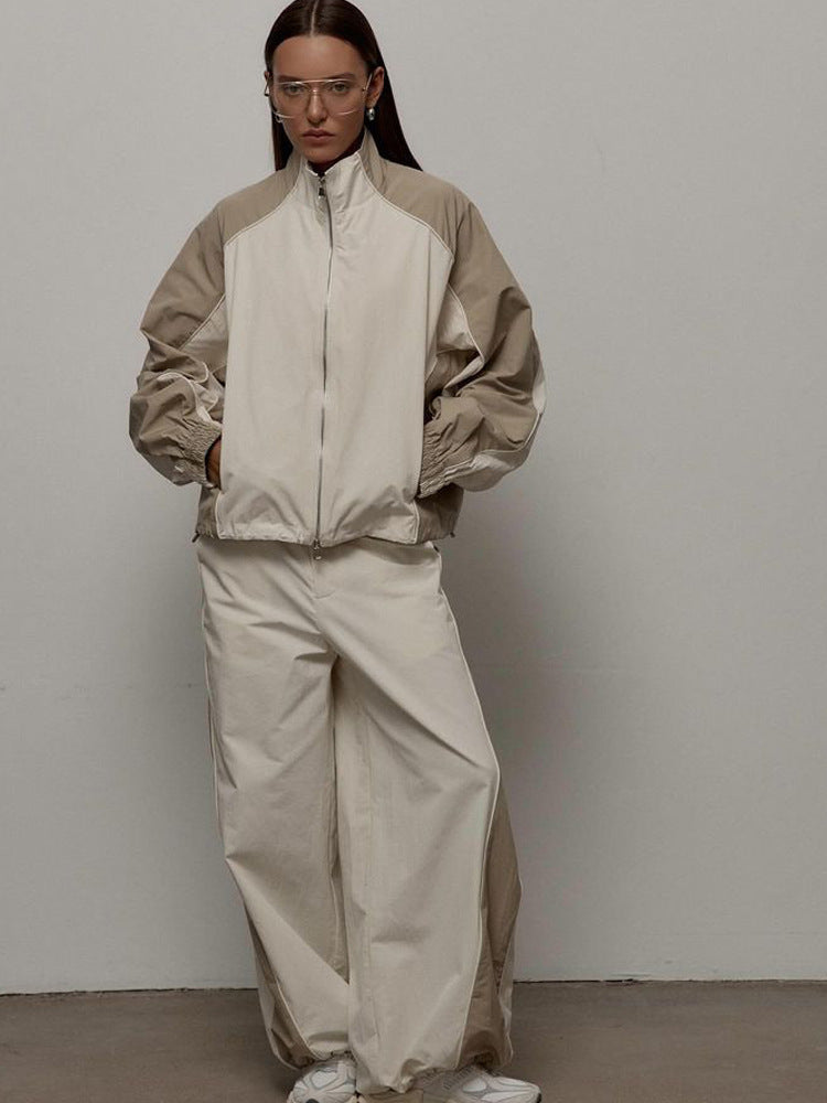 Damen Sportjacke mit hoch stehendem Kragen und kontrastierenden Ärmeln WW