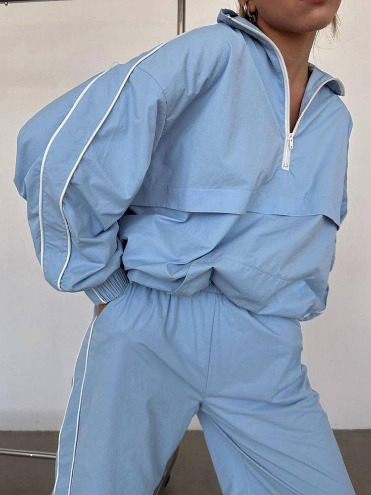 Damen sportliches Windbreaker-Set mit funktionalem Halbreißverschluss und seitlichen Kontraststreifen WW