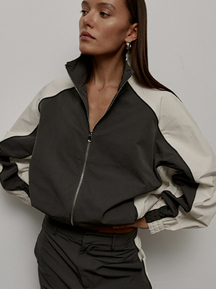 Damen Sportjacke mit hoch stehendem Kragen und kontrastierenden Ärmeln WW